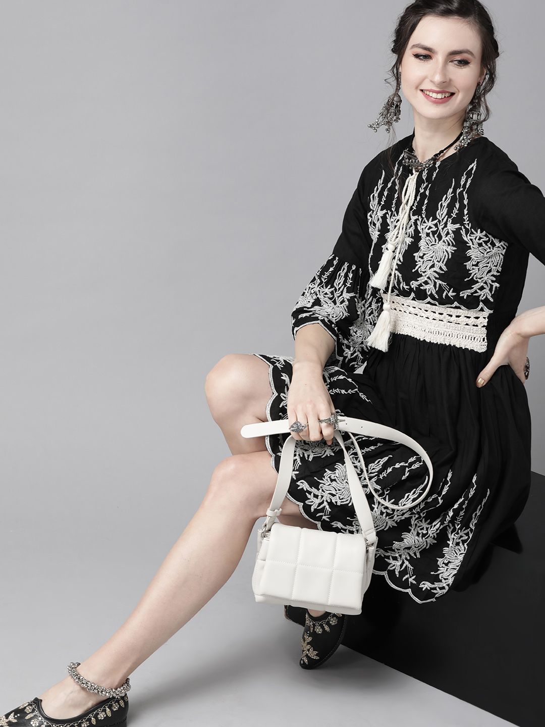 Comfy Black Cotton Embroidered Fit & Flare Dress With Bell Sleeves And Scalloped Hemline
