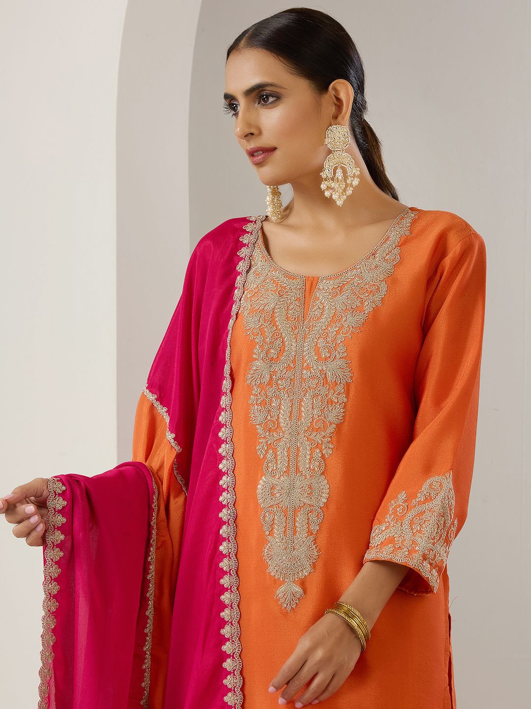 Chinon Orange And Pink Zari Embroidered Kurta Set With Sharara Bottom And Silk Blend Tassel Dupatta
