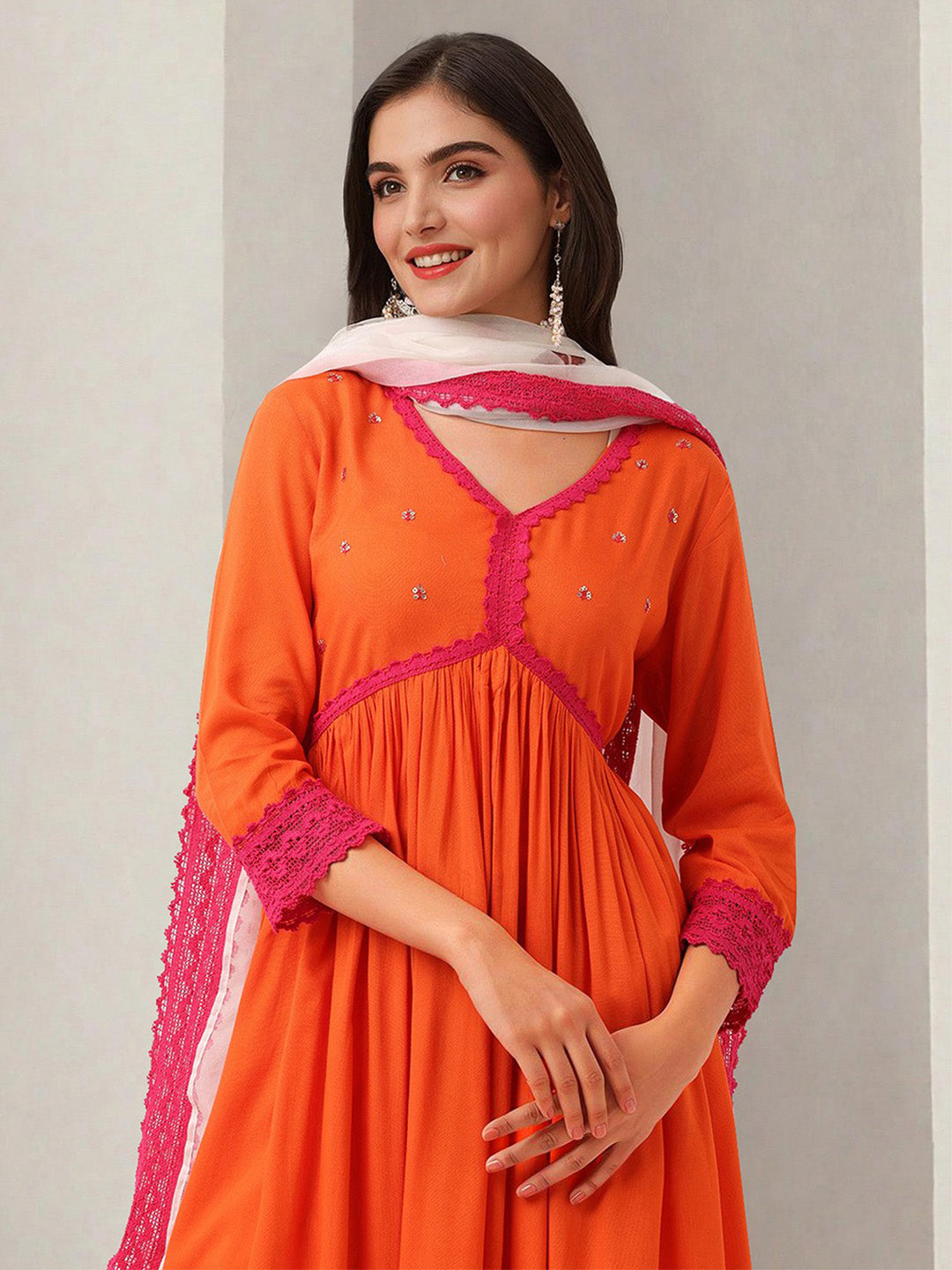 Graceful Orange Poly Rayon solid Anarkali fit kurta set with statement dupatta