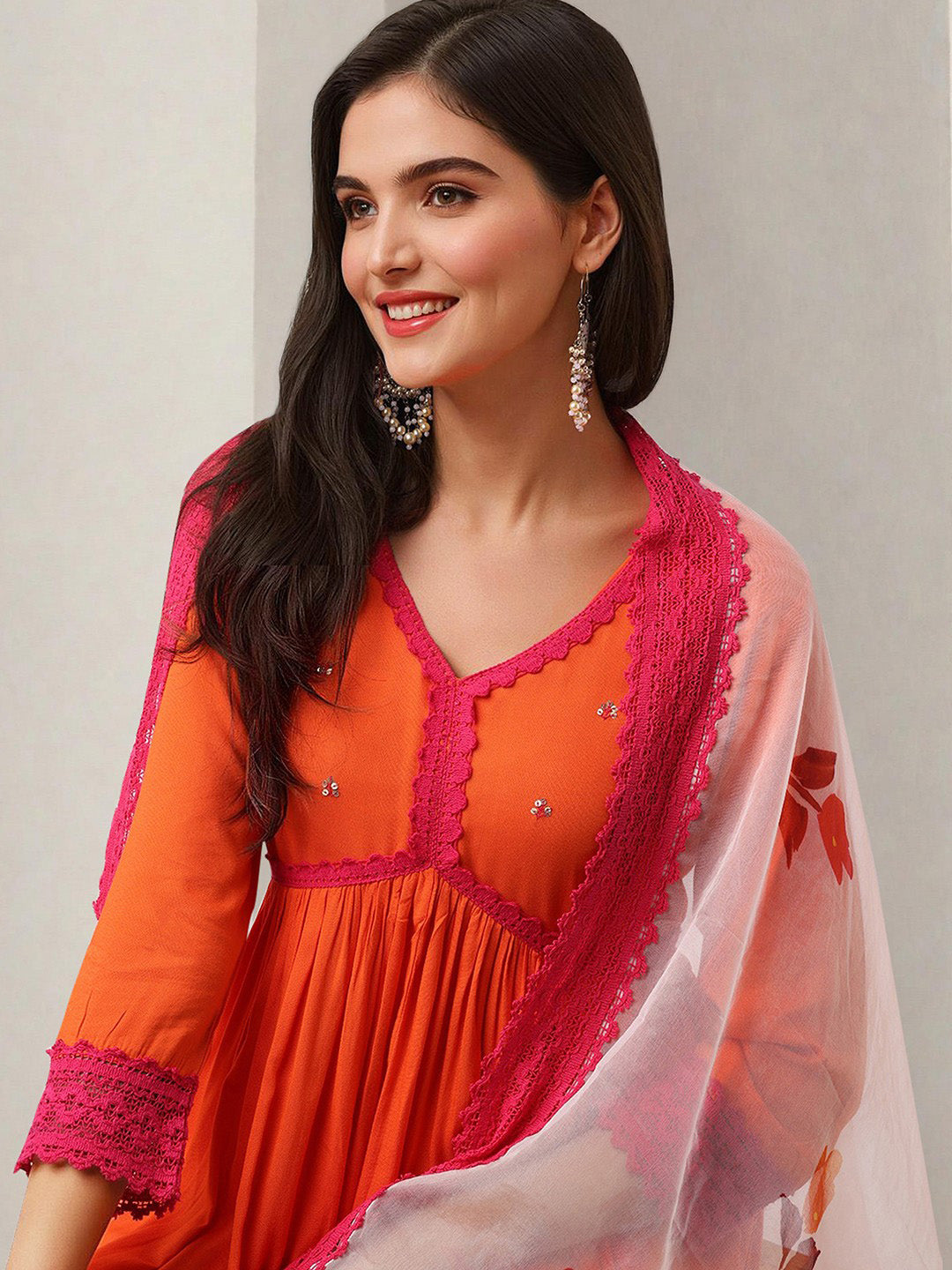 Graceful Orange Poly Rayon solid Anarkali fit kurta set with statement dupatta