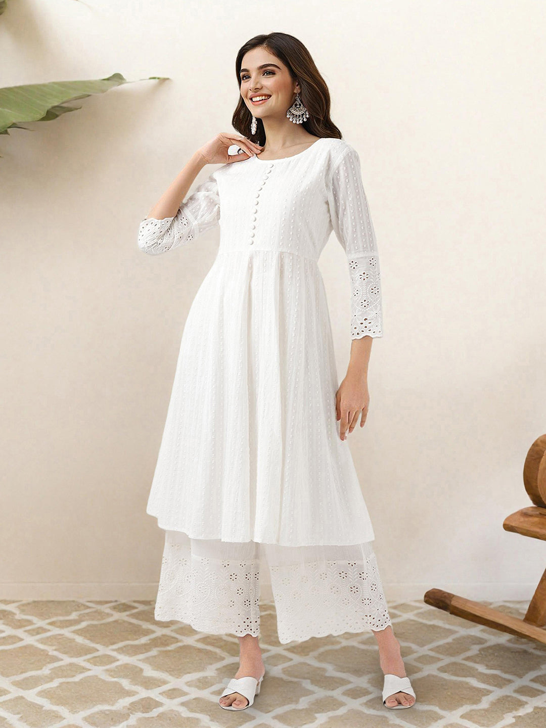 Comfy Off-White Pure Cotton Floral Printed Kurta Set With Gotta Patti Detailing And Straight Bottom
