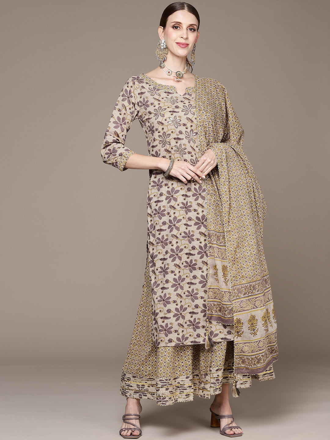 Ishin Women Beige Floral Embroidered Beads and Stones Kurta with Sharara & With Dupatta